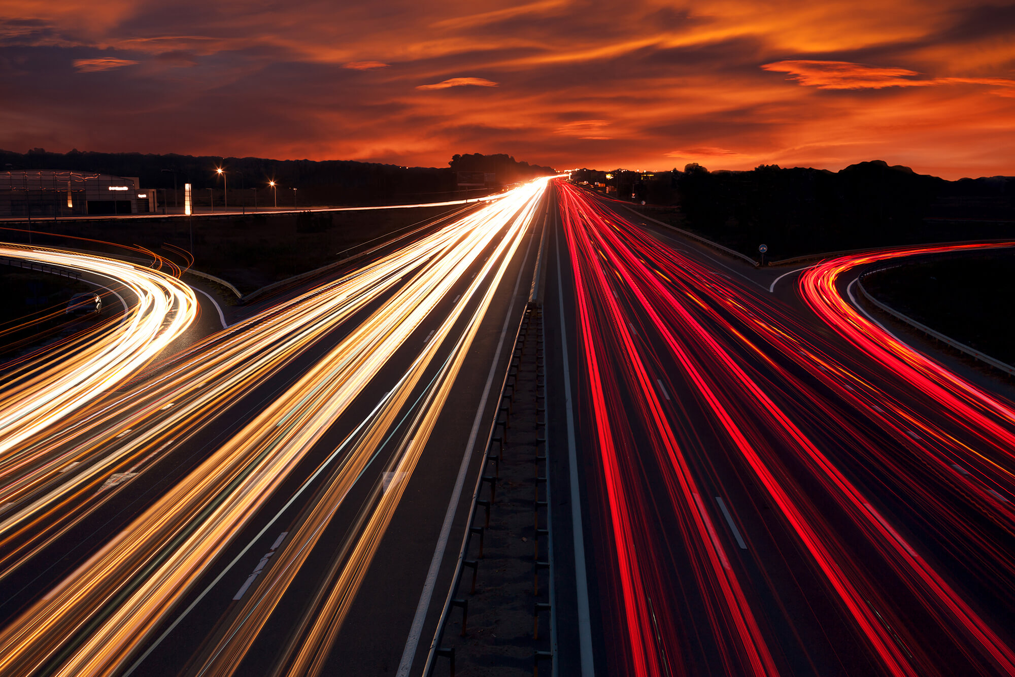 Speed Traffic light trails on motorway highway at night, long LW